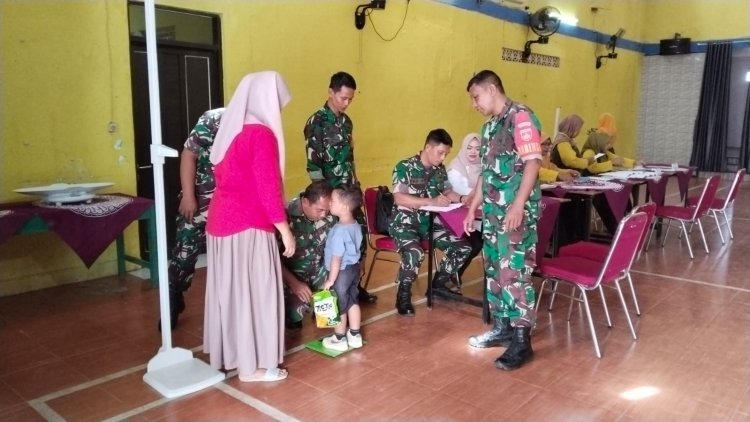 Babinsa Turut Hadir Dan Membantu Dalam Kegiatan Posyandu